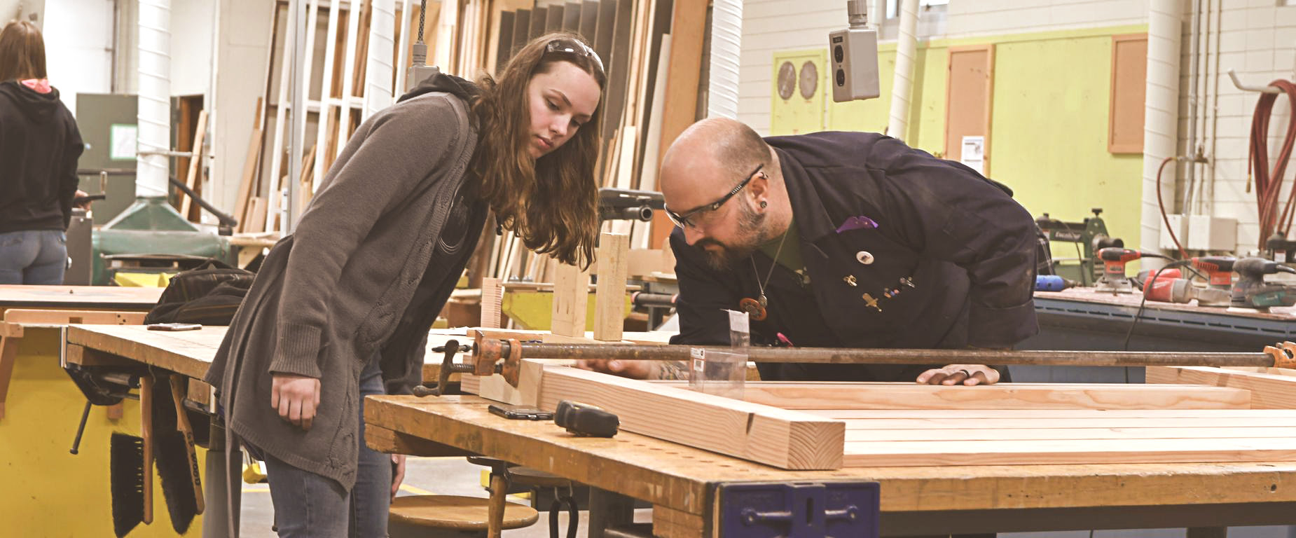 Girl and Teacher in Wood Work class