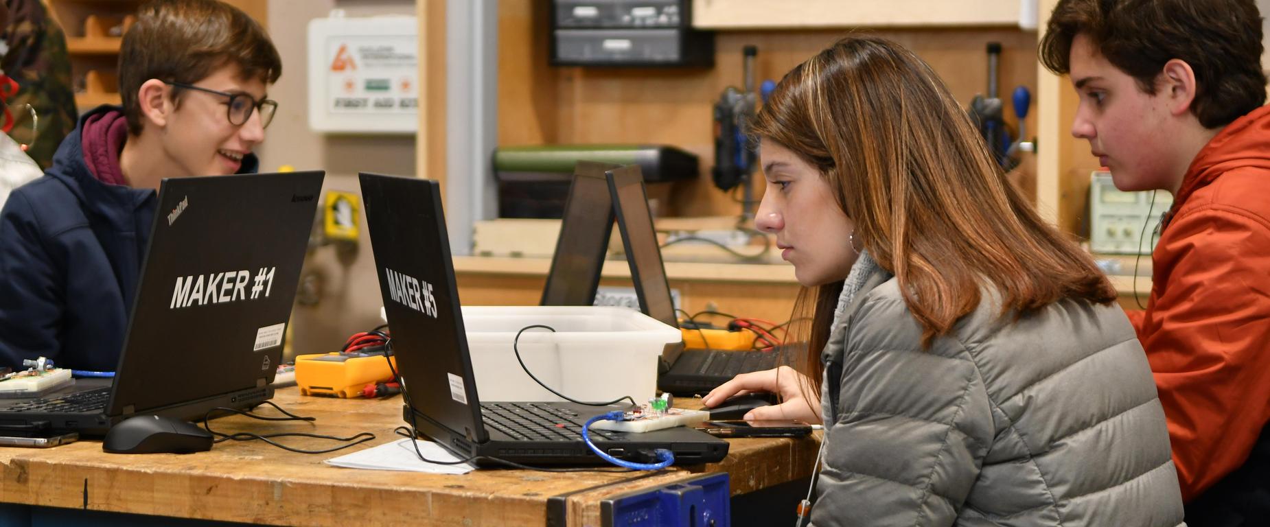 Maker students using laptops